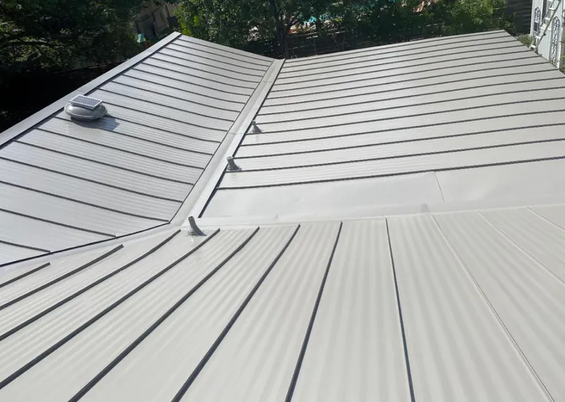 Solar attic fan installed on a metal roof for Roof Ventilation in Wood River